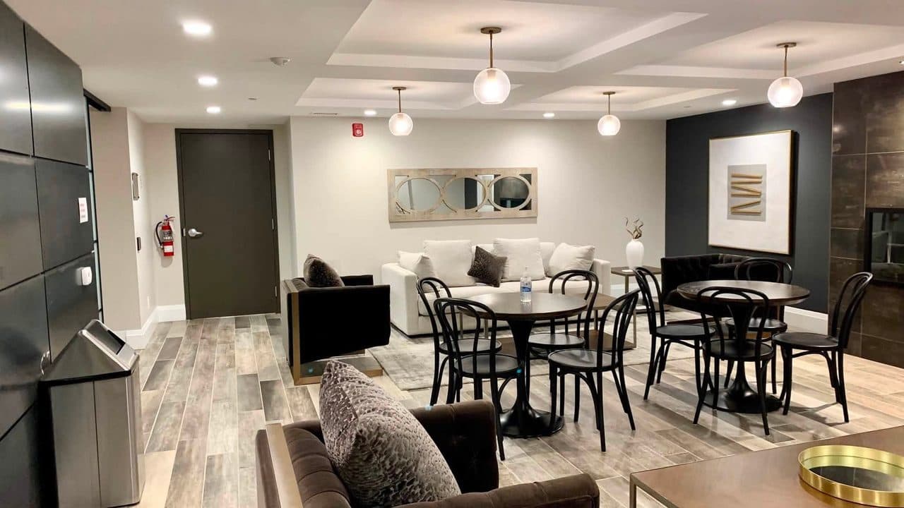 Condo amenity lounge and dining area after a professional clean by Pro City Maids